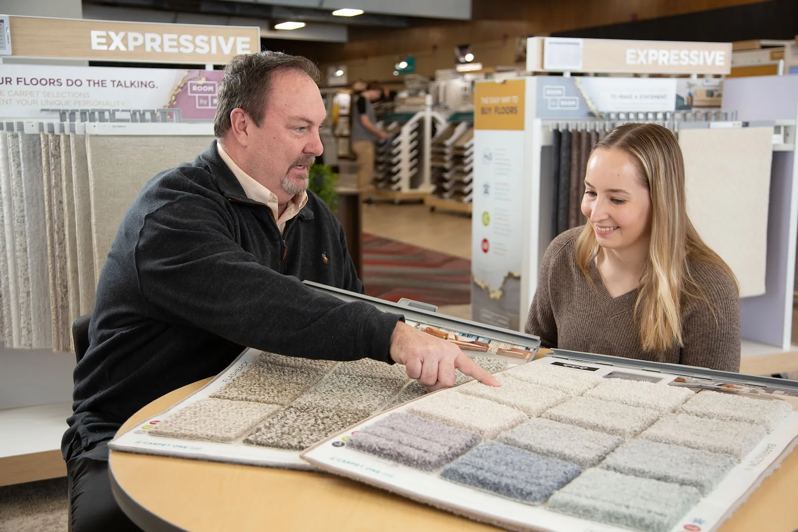 Sales person with carpet samples